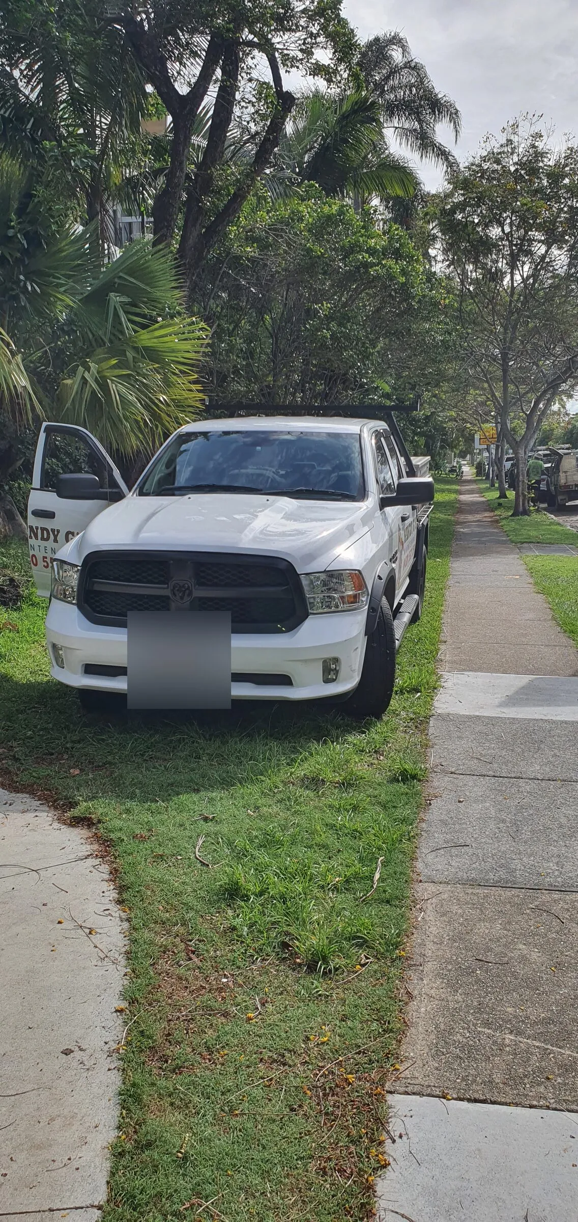 The same RAM before the fit-up, standing on the verge with the factory front bar still on.