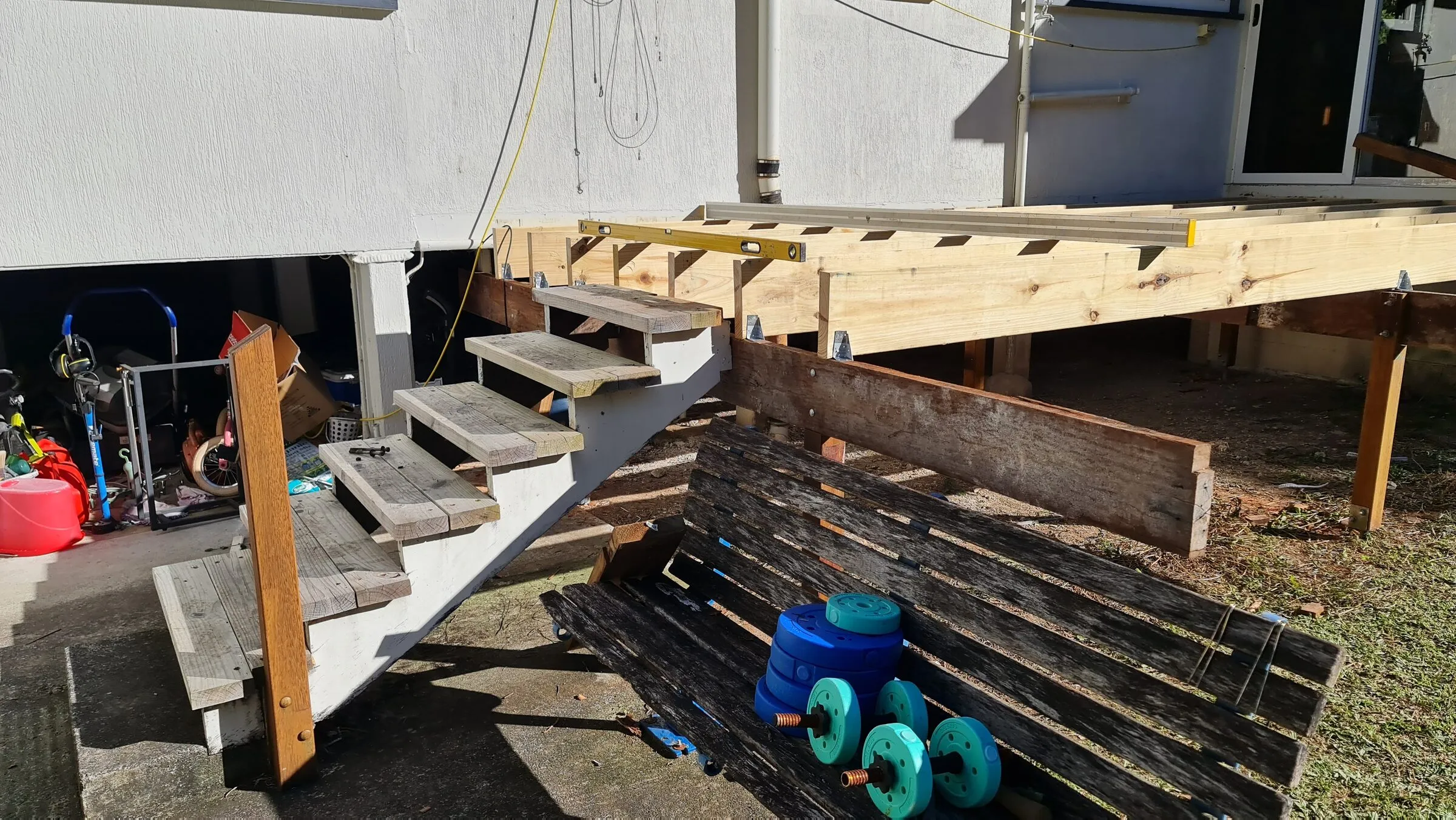 The new subfloor beside the old timber stair, ready for the boards to go down.